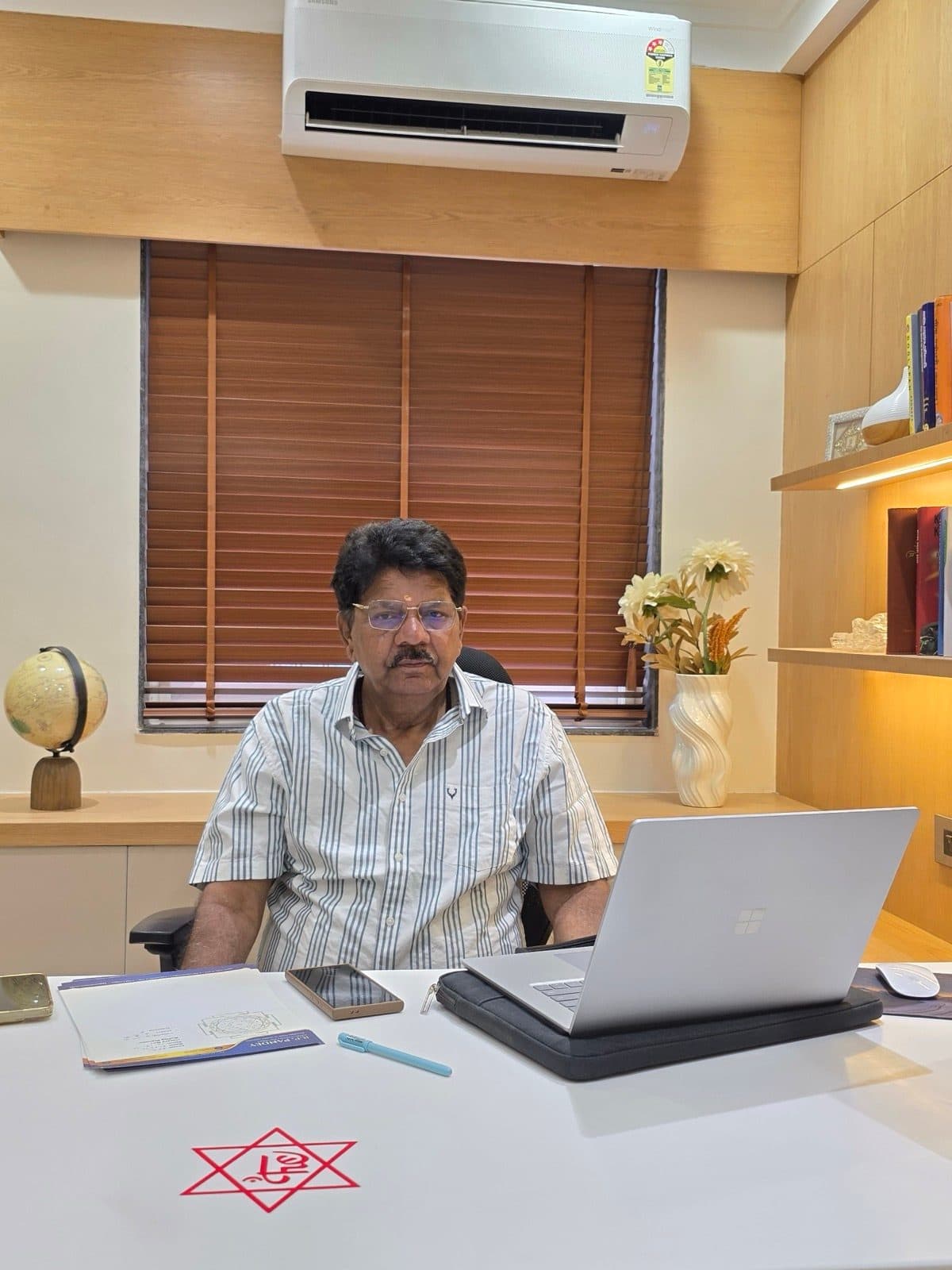 R P Pandey, KP, Vedic & horary astrologer, at his consultation desk